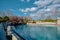 A blue swimming pool in a zoo for penguins and seals