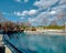 A blue swimming pool in a zoo for penguins and seals