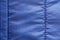 Blue synthetics fabric background of a fragment of crumpled cloth