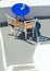 Blue table and chairs on terrace in Oia, Santorini, Cyclades, Gr