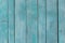 Blue Temperate turquoise old wooden fence. wood palisade background. planks texture, weathered surface