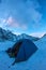 Blue tent in the base camp in the mountains