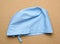 Blue textile medical cap with ties for doctor