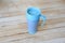 Blue thermo mug on wooden background