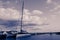 Blue toned nautical yacht landscape with bright cloudy sky