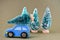 Blue toy car with a christmas tree on the roof. High resolution photo as a Christmas background.