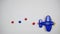 Blue toy plane moves on a white background. The trace of the turbines formed the word sale. Stop motion