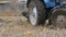 Blue tractor plows steel ground furrows in late autumn in field