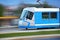 Blue tram rider fast on rails