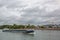 blue transport ship on the river rhine passing the city of Neuwied