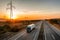 Blue transporter Truck with white trailer on highway at sunset