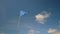 Blue triangle flag against blue sky in France