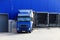 Blue truck at loading docks