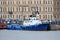 Blue tugboat PERSEUS stands at the embankment of Lieutenant Schmidt at the festival in St. Petersburg