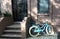 A blue turquoise bicycle in front of a brownstone