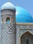 Blue turquoise dome with a minaret of the Sher dor Madrasah in Uzbekistan.
