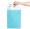 Blue turquoise paper package bag in hand shop shopping dress fashion