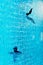 Blue turquoise swimming pool background   with shadow of man swimming natural vacation background