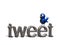 Blue twittering bird standing on the word tweet