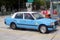 Blue urban taxi cab in Hong Kong.