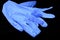 Blue used gloves on a black background. Coronavirus Remedy