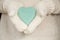 Blue Valentines Day Heart in Hands With Knit Mittens