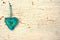 Blue valentines handmade heart on a white old wooden door