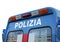 blue van during a revolt in the square with the text POLIZIA mea