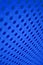 Blue vertical neon abstract pattern with holes and lines