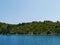 A blue vessel in a bay in Croatia