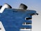 Blue vessel / ship with smokestacks in light blue sky