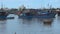 Blue Vietnamese ships moored on the river.red flags are developed in the wind.