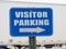 Blue visitor parking sign