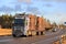 Blue Volvo FH16 Wood Transport Truck on Highway in Winter