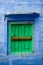 Blue wall and green shutters