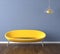 Blue wall with yellow couch