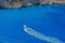 Blue water background. Motor boating on azure water, Ionian Sea - Zakynthos Island, landmark attraction in Greece. Seascape