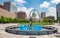 Blue water fountain with Runner Statue at Kiener Plaza Park in St. Louis - ST. LOUIS, USA - JUNE 19, 2019