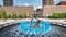 Blue water fountain with Runner Statue at Kiener Plaza Park in St. Louis - ST. LOUIS, USA - JUNE 19, 2019