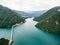 Blue water of Lake Piva at the bottom of the canyon. Montenegro