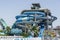 Blue water Park twisted water slide amusement resort for luxury children and family vacations on a warm sunny tropical day