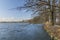 Blue water pond near Budweis city in winter windy sunny day