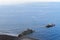 Blue water and the rocks on the Praia Formosa on Portuguese island of Madeira