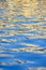 Blue water surface of pool with bizarre waves. Fantastic abstract reflections and glare on water. Close-up. Copy space.