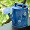 Blue watering can