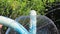 A blue waterpark fountain play structure at an amusement water park.