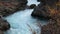 Blue Waters at Hraunfossar Waterfall in Iceland in Autumn