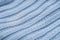 Blue waved knitwear texture background macro