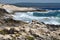 Blue waves crashing on a shoreline