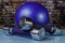 Blue weights and blue exercising ball on blue table